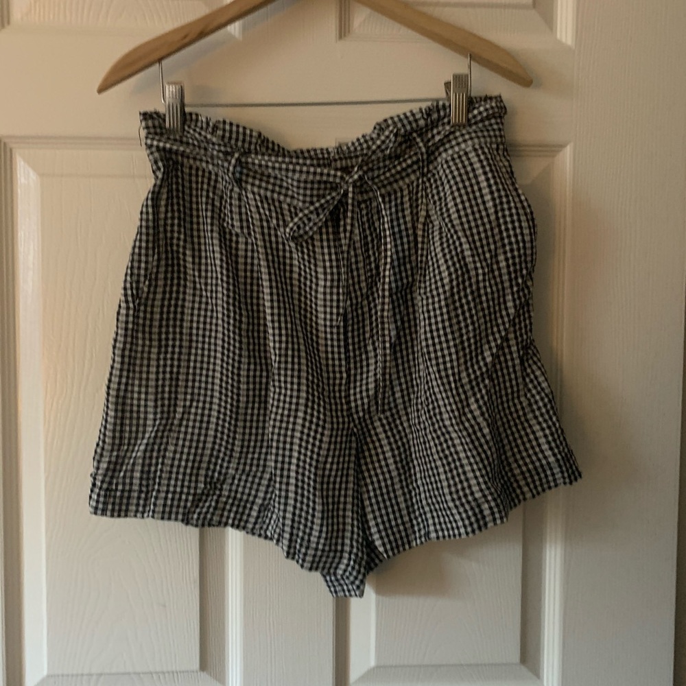 Black and white plaid shorts.